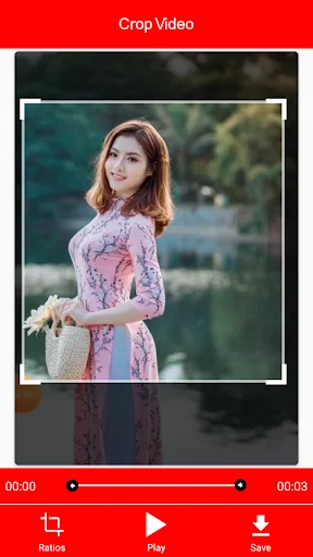 Video crop editor with adjustable crop frame, timeline controls, pause button, and save option