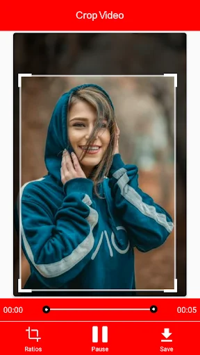 Video crop editor showing person with adjustable crop frame handles, timeline, and save button