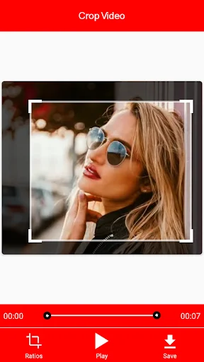 Video crop editor interface with portrait video, white crop selection frame, and playback controls
