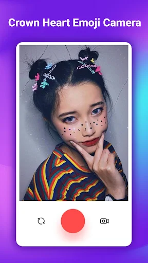 Selfie with skull emoji hairstyle buns and decorative star sparkle face marks in beauty camera app