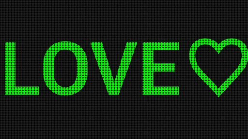 Green LED banner display showing 'LOVE' text with heart in bright neon style on pixelated grid background