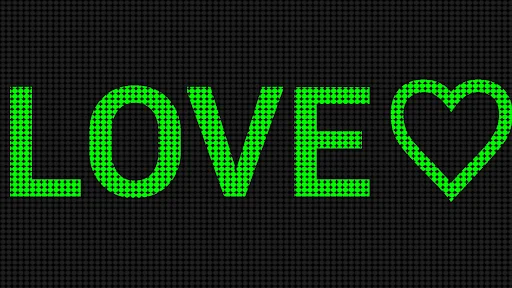 Green LED banner display showing 'LOVE' text with heart in bright neon style on pixelated grid background