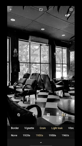 Black and white office scene with vintage 8mm filters displayed: Border, Vignette, Grain, Light leak, and decade options from 1920s-1960s