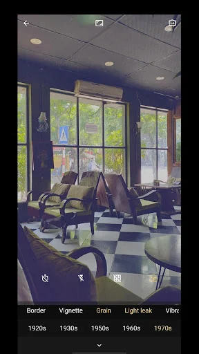 Office interior photograph with purple-blue vintage film filter applied using 8mm camera app effects