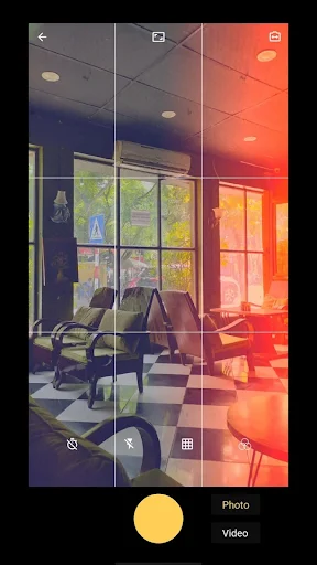 Vintage camera app with office interior preview, grid overlay, and warm color filter selection interface